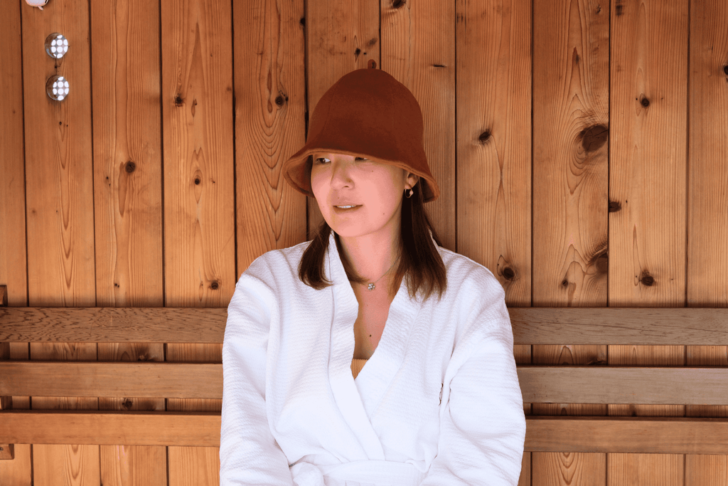 Women in Sauna hat in a sauna